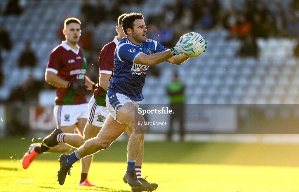 5 December 2021; Paddy Dowdall of St Loman's in action against Ronan Coffey of Portarlington during the AIB Leinster GAA Football Senior Club Championship Quarter-Final match between Portarlington and St Loman's at MW Hire O’Moore Park in Portlaoise, Laois. Photo by Matt Browne/Sportsfile