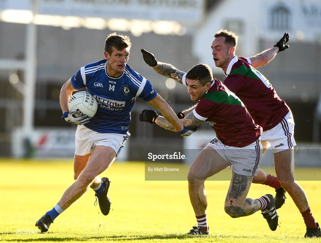 5 December 2021; John Heslin of St Loman's in action against Stuart Mulpeter and Adam Ryan of Portarlington during the AIB Leinster GAA Football Senior Club Championship Quarter-Final match between Portarlington and St Loman's at MW Hire O’Moore Park in Portlaoise, Laois. Photo by Matt Browne/Sportsfile