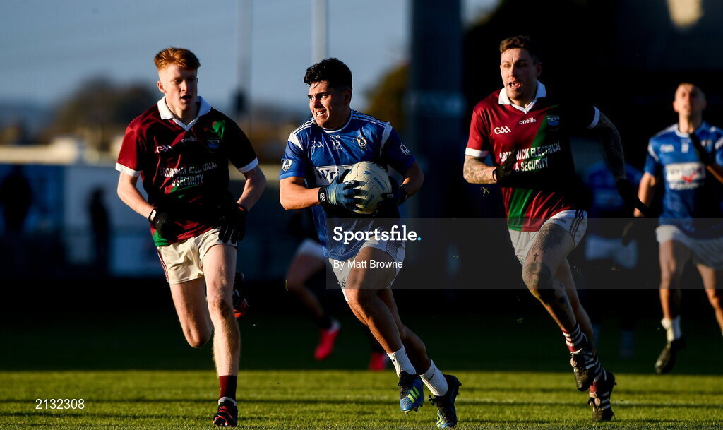 5 December 2021; TJ Cox of St Loman's in action against Rioghan Murphy and Stuart Mulpeter of Portarlington during the AIB Leinster GAA Football Senior Club Championship Quarter-Final match between Portarlington and St Loman's at MW Hire O’Moore Park in Portlaoise, Laois. Photo by Matt Browne/Sportsfile
