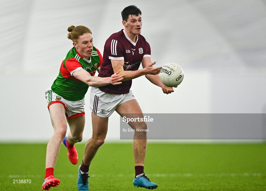 7 January 2022; Cormac McWalter of Galway is tackled by Paddy Heneghan of Mayo during the Connacht FBD League semi-final match between Mayo and Galway at the NUI Galway Connacht GAA Air Dome in Bekan, Mayo. Photo by Eóin Noonan/Sportsfile