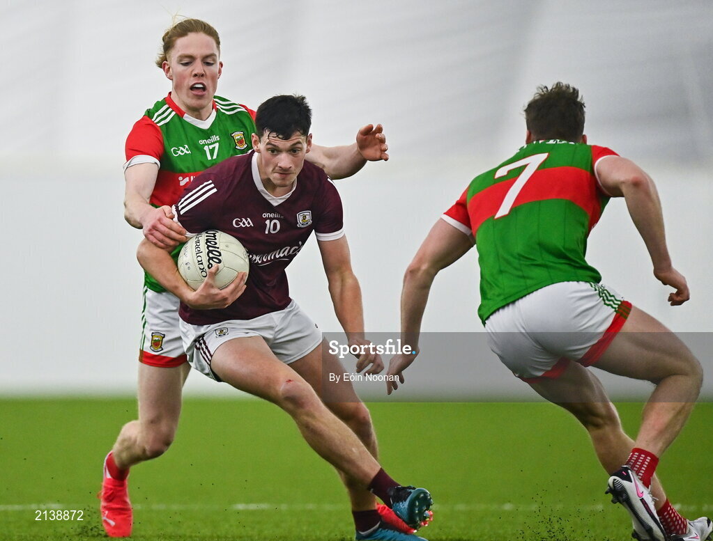 7 January 2022; Cormac McWalter of Galway is tackled by Paddy Heneghan of Mayo during the Connacht FBD League semi-final match between Mayo and Galway at the NUI Galway Connacht GAA Air Dome in Bekan, Mayo. Photo by Eóin Noonan/Sportsfile