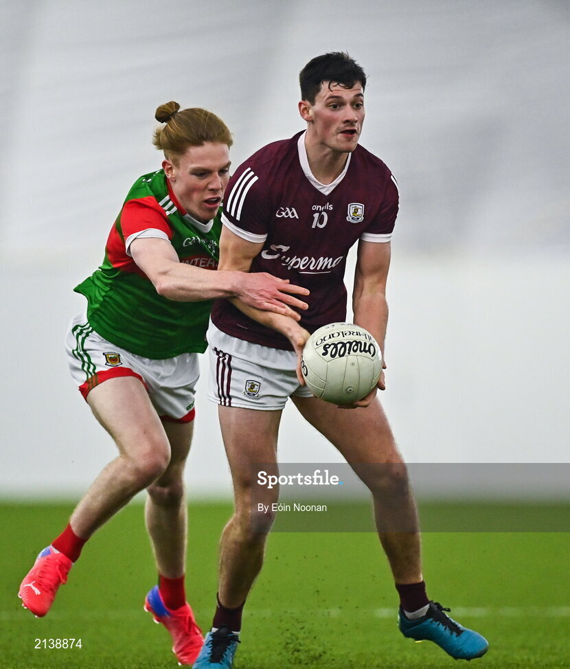 7 January 2022; Cormac McWalter of Galway is tackled by Paddy Heneghan of Mayo during the Connacht FBD League semi-final match between Mayo and Galway at the NUI Galway Connacht GAA Air Dome in Bekan, Mayo. Photo by Eóin Noonan/Sportsfile
