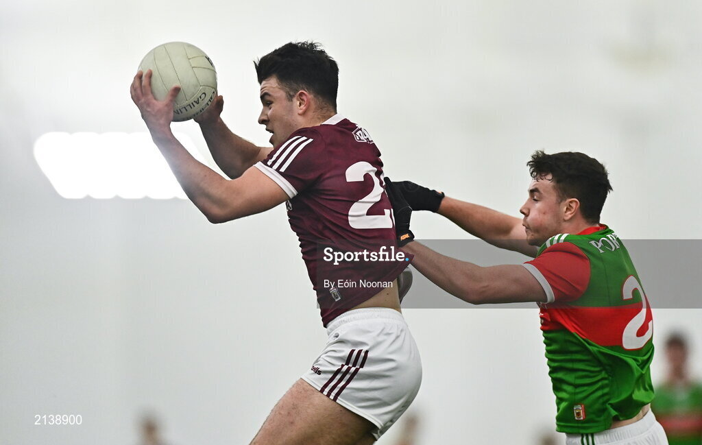 7 January 2022; Tomo Culhane of Galway in action against Ruairi Keane of Mayo during the Connacht FBD League semi-final match between Mayo and Galway at the NUI Galway Connacht GAA Air Dome in Bekan, Mayo. Photo by Eóin Noonan/Sportsfile