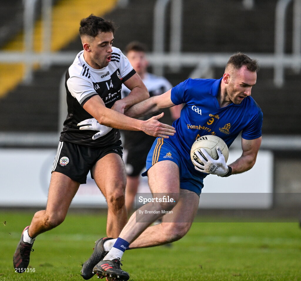 29 January 2022; Eoin Comyns of St Finbarr's in action against Ryan Johnston of Kilcoo during the AIB GAA Football All-Ireland Senior Club Championship Semi-Final match between St Finbarr's, Cork, and Kilcoo, Down, at MW Hire O'Moore Park in Portlaoise, Laois. Photo by Brendan Moran/Sportsfile