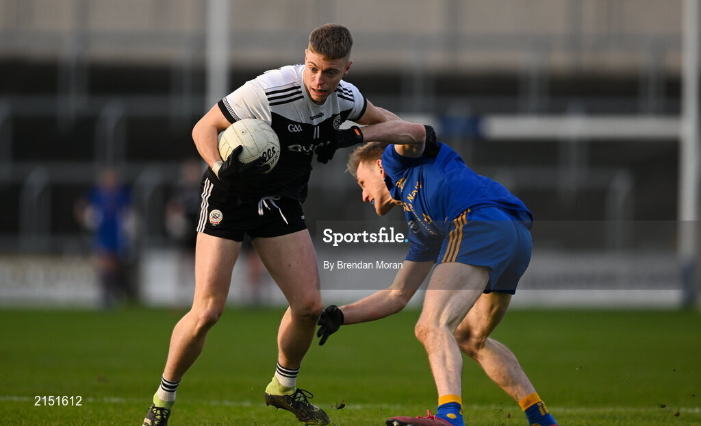 29 January 2022; Jerome Johnston of Kilcoo is tackled by Ryan of St Finbarr's during the AIB GAA Football All-Ireland Senior Club Championship Semi-Final match between St Finbarr's, Cork, and Kilcoo, Down, at MW Hire O'Moore Park in Portlaoise, Laois. Photo by Brendan Moran/Sportsfile