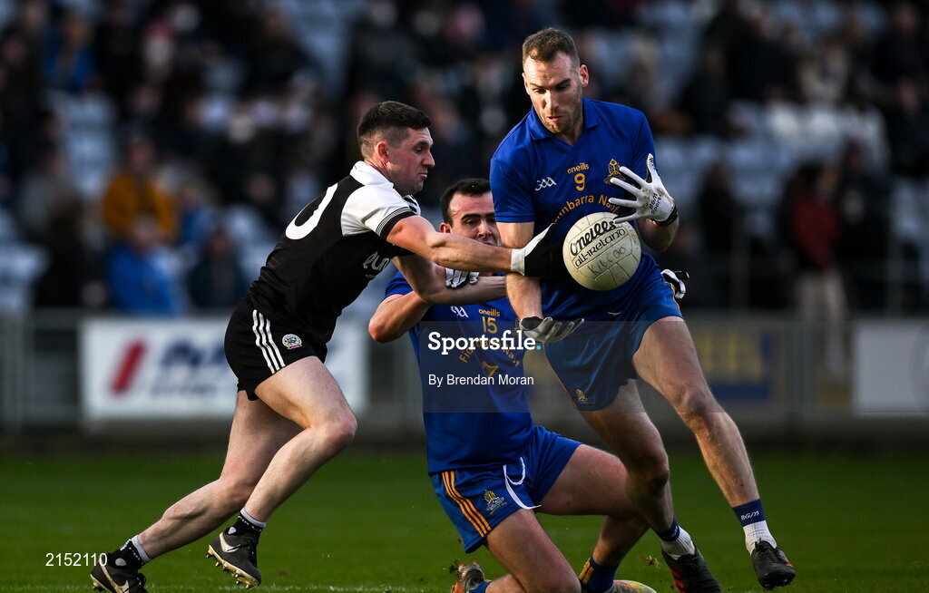 29 January 2022; Eoin Comyns of St Finbarr's is tackled by Daryl Branagan of Kilcoo during the AIB GAA Football All-Ireland Senior Club Championship Semi-Final match between St Finbarr's, Cork, and Kilcoo, Down, at MW Hire O'Moore Park in Portlaoise, Laois. Photo by Brendan Moran/Sportsfile
