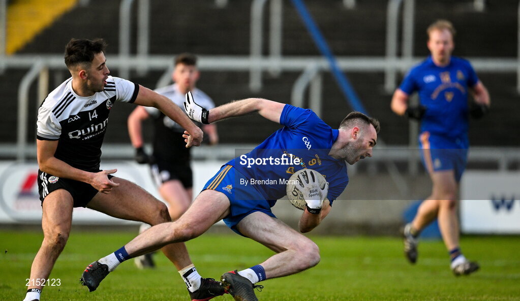 29 January 2022; Eoin Comyns of St Finbarr's in action against Ryan Johnston of Kilcoo during the AIB GAA Football All-Ireland Senior Club Championship Semi-Final match between St Finbarr's, Cork, and Kilcoo, Down, at MW Hire O'Moore Park in Portlaoise, Laois. Photo by Brendan Moran/Sportsfile