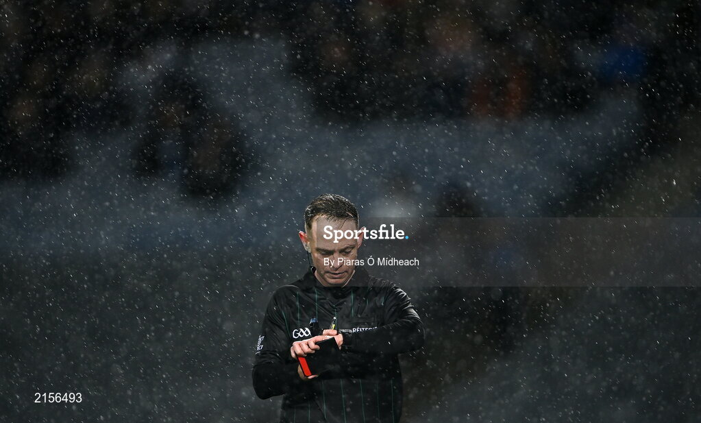 5 February 2022; Referee Chris Mooney checks his watch during heavy rain in the AIB GAA Hurling All-Ireland Junior Club Championship Final match between Ballygiblin, Cork, and Mooncoin, Kilkenny, at Croke Park in Dublin. Photo by Piaras Ó Mídheach/Sportsfile