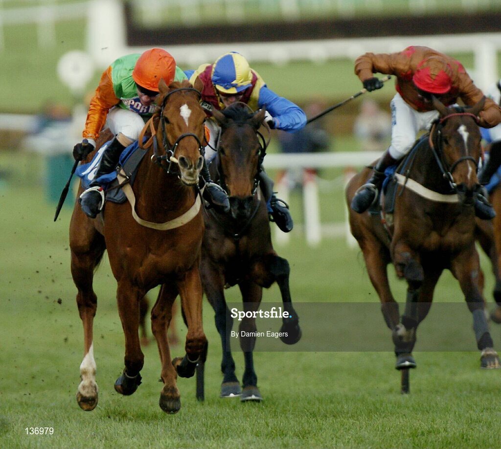 17 March 2004; Tikram, left, with Timmy Murphy up, races ahead of Iznogoud, centre, with Tony McCoy, and Fondmort, with Mick Fitzgerald, on the way to winning the 54th Year the Mildmay of flete Challenge Cup Handicap Steeple Chase, Cheltenham Festival, Prestbury Park, Cheltenham, England. Horse Racing. Picture credit; Damien Eagers / SPORTSFILE *EDI*