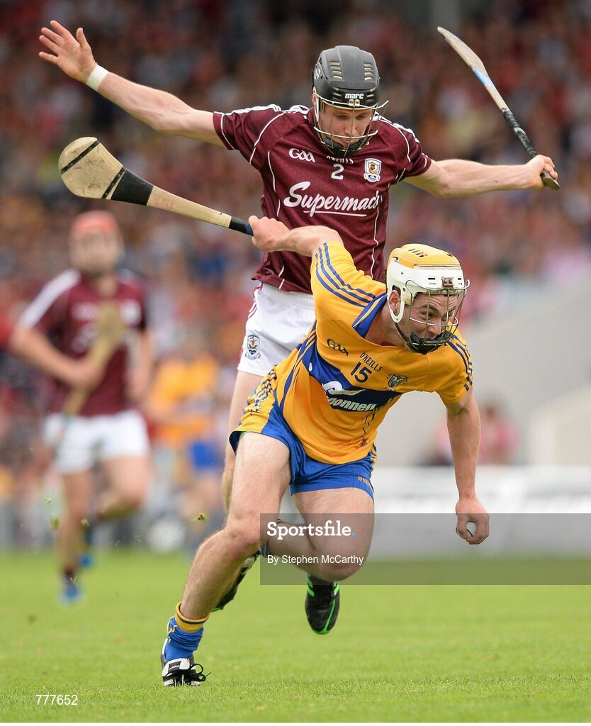 28 July 2013; Conor McGrath, Clare, on his way to scoring his side's first goal despite the efforts of Kevin Hynes, Galway. GAA Hurling All-Ireland Senior Championship, Quarter-Final, Galway v Clare, Semple Stadium, Thurles, Co. Tipperary. Picture credit: Stephen McCarthy / SPORTSFILE