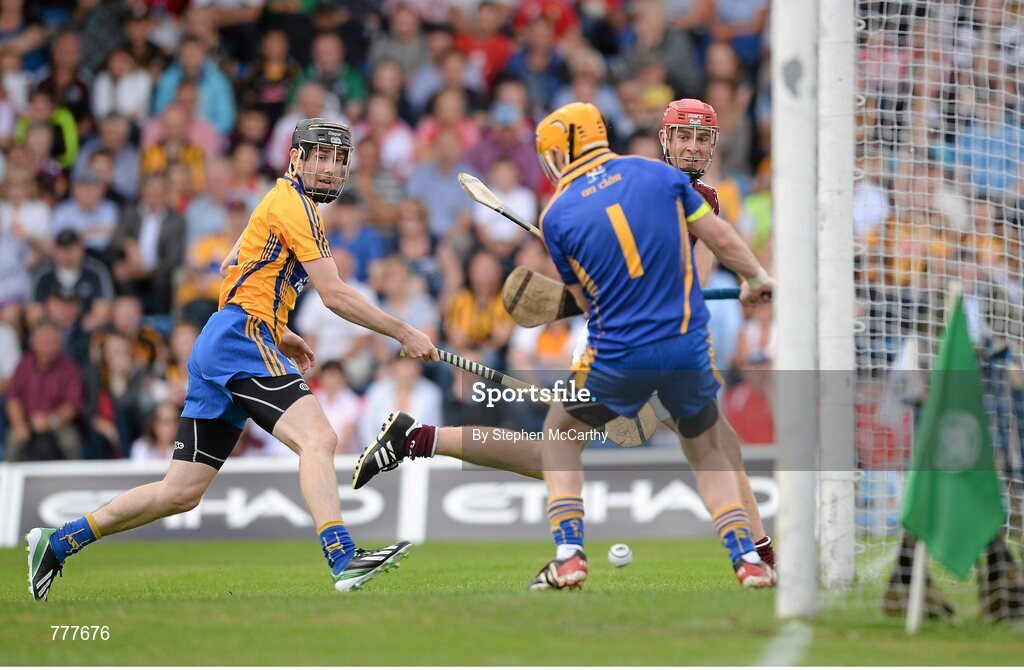 28 July 2013; Jonathan Glynn, Galway, shoots to score his side's first goal past Clare goalkeeper Patrick Kelly and Patrick Donnellan, left. GAA Hurling All-Ireland Senior Championship, Quarter-Final, Galway v Clare, Semple Stadium, Thurles, Co. Tipperary. Picture credit: Stephen McCarthy / SPORTSFILE