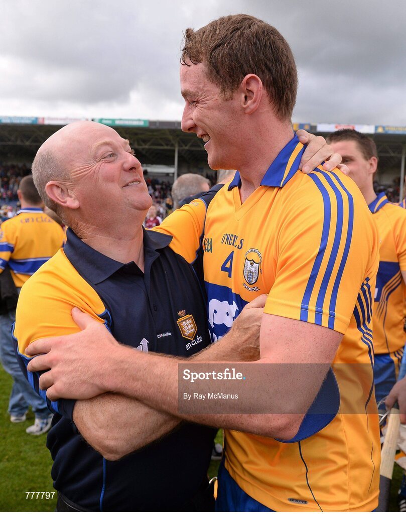 28 July 2013; Clare's Cian Dillon celebrates with a supporter after the game. GAA Hurling All-Ireland Senior Championship, Quarter-Final, Galway v Clare, Semple Stadium, Thurles, Co. Tipperary. Picture credit: Ray McManus / SPORTSFILE