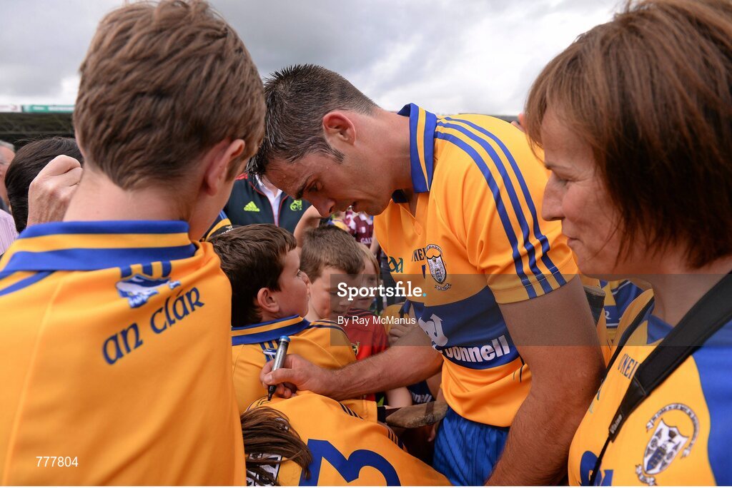 28 July 2013; Clare's Brendan Bugler signs jerseys for supporters after the game. GAA Hurling All-Ireland Senior Championship, Quarter-Final, Galway v Clare, Semple Stadium, Thurles, Co. Tipperary. Picture credit: Ray McManus / SPORTSFILE