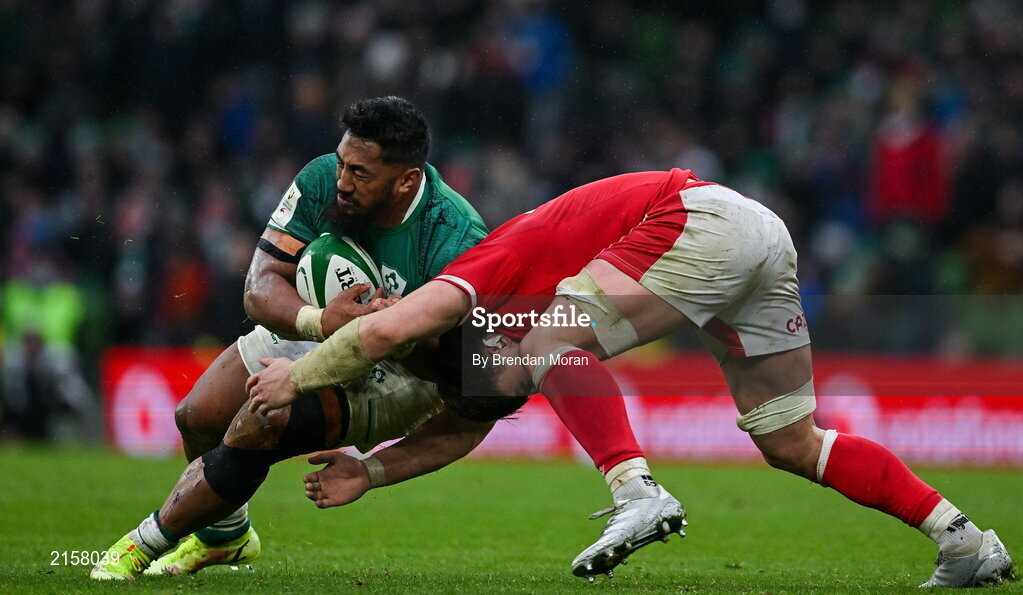 5 February 2022; Bundee Aki of Ireland is tackled by Taine Basham of Wales during the Guinness Six Nations Rugby Championship match between Ireland and Wales at Aviva Stadium in Dublin. Photo by Brendan Moran/Sportsfile