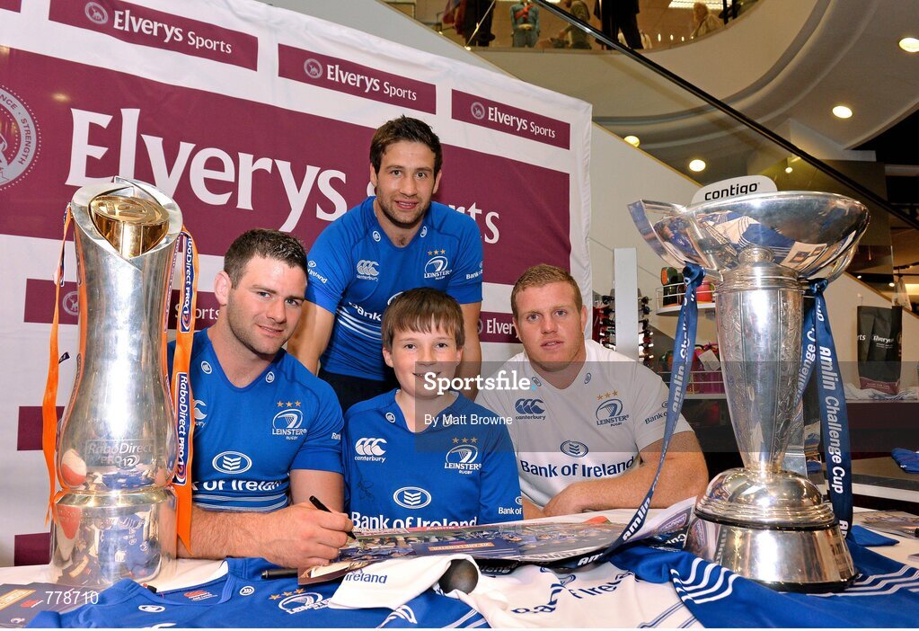 1 August 2013: Leinster players Fergus McFadden, left, Kevin McLaughlin, behind, and Sean Cronin, right, with Cian Maxwell, from Maynooth, Co. Kildare, at Canterbury's launch of the new Leinster 2013/14 jersey, hosted by Elverys Sports in Arnotts. Leinster will wear the new jersey in match action for the first time at home on Friday 30th August, when they come up against Northampton Saints in a friendly at the Donnybrook Stadium. Elverys Sports, Arnotts, Dublin. Picture credit: Matt Browne / SPORTSFILE