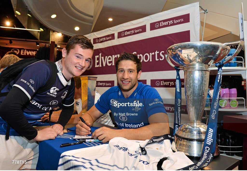 1 August 2013: Leinster's Kevin McLaughlin with Keith Mills, from Ballymun, Dublin, at Canterbury's launch of the new Leinster 2013/14 jersey, hosted by Elverys Sports in Arnotts. Leinster will wear the new jersey in match action for the first time at home on Friday 30th August, when they come up against Northampton Saints in a friendly at the Donnybrook Stadium. Elverys Sports, Arnotts, Dublin. Picture credit: Matt Browne / SPORTSFILE
