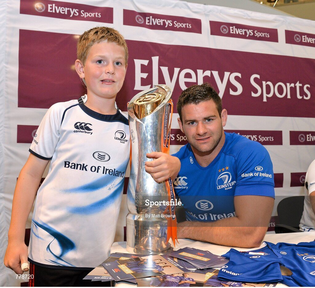 1 August 2013: Leinster's Fergus McFadden with Karac Moran, from Sandymount, Dublin, at Canterbury's launch of the new Leinster 2013/14 jersey, hosted by Elverys Sports in Arnotts. Leinster will wear the new jersey in match action for the first time at home on Friday 30th August, when they come up against Northampton Saints in a friendly at the Donnybrook Stadium. Elverys Sports, Arnotts, Dublin. Picture credit: Matt Browne / SPORTSFILE