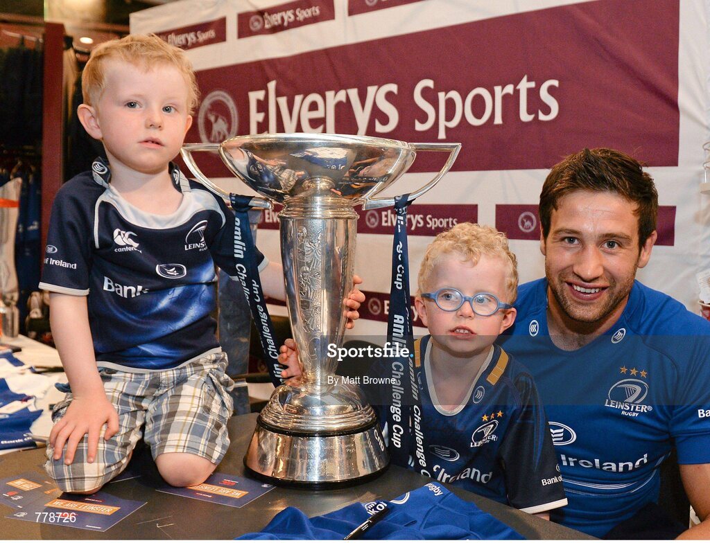 1 August 2013: Leinster's Kevin McLaughlin with four year old Ciaran O'Flynn, left, and his six year old brother Colman, from Ranelagh, Dublin, at Canterbury's launch of the new Leinster 2013/14 jersey, hosted by Elverys Sports in Arnotts. Leinster will wear the new jersey in match action for the first time at home on Friday 30th August, when they come up against Northampton Saints in a friendly at the Donnybrook Stadium. Elverys Sports, Arnotts, Dublin. Picture credit: Matt Browne / SPORTSFILE