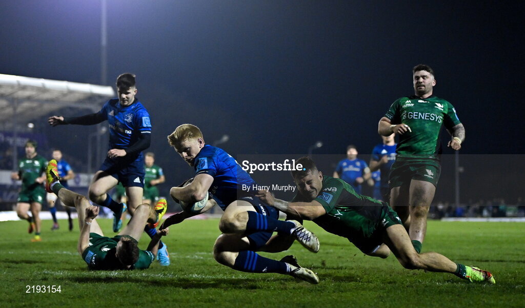 26 March 2022; Tommy O'Brien of Leinster scores his side's seventh try despite the tackle of Tiernan O'Halloran of Connacht during the United Rugby Championship match between Connacht and Leinster at the Sportsground in Galway. Photo by Harry Murphy/Sportsfile