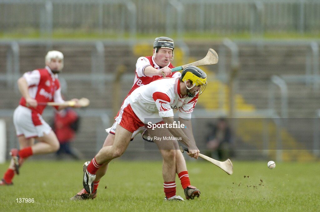 28 March 2004; Vincent Owens, Tyrone, in action against Louth's Alan Myres. Allianz National Hurling League Division 3B, Round 5, Tyrone v Louth, Healy Park, Omagh, Co. Tyrone. Picture credit; Ray McManus / SPORTSFILE *EDI*