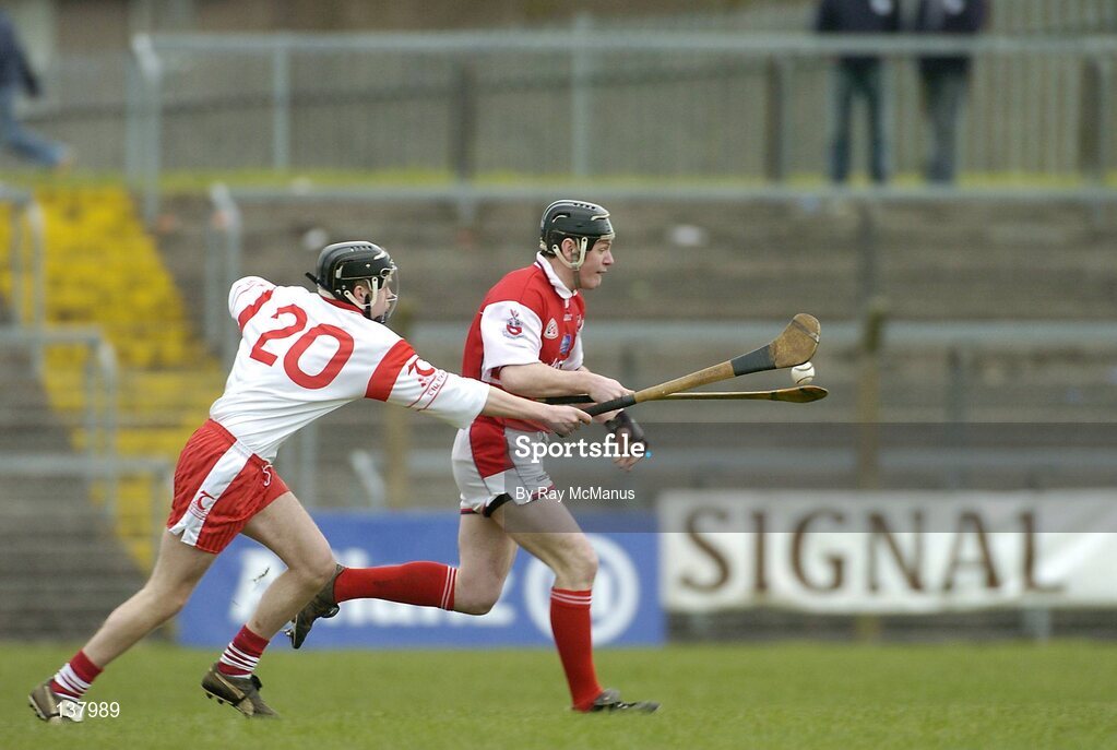 28 March 2004; Donach Callan, Louth, in action against Tyrone's Joseph O'Neill. Allianz National Hurling League Division 3B, Round 5, Tyrone v Louth, Healy Park, Omagh, Co. Tyrone. Picture credit; Ray McManus / SPORTSFILE *EDI*