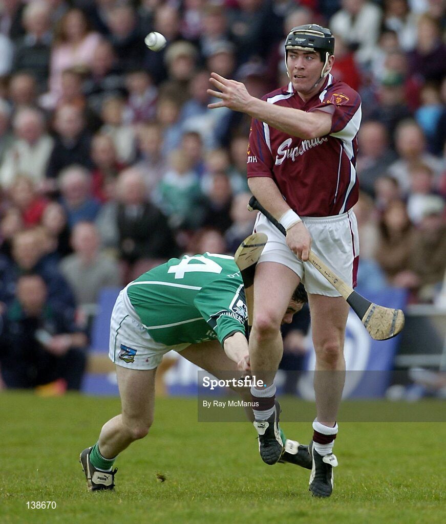 25 April 2004; Eugene Cloonan, Galway, in action against Eoin O'Neill, Limerick. Allianz Hurling League 2004, Round 3, Division 1, Galway v Limerick, Pearse Stadium, Galway. Picture credit; Ray McManus / SPORTSFILE *EDI*