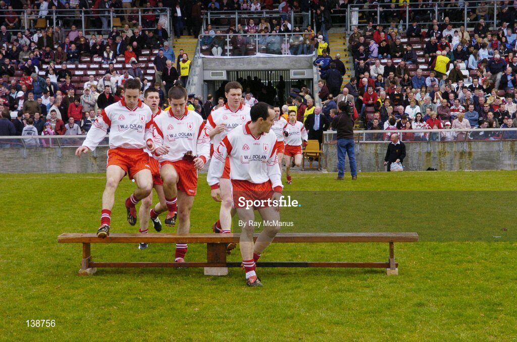 25 April 2004; Brian Dooher leads the Tyrone team to the bench for the team photograph. Allianz Football League 2004, Semi-Final Replay, Galway v Tyrone, Pearse Stadium, Galway. Picture credit; Ray McManus / SPORTSFILE *EDI*