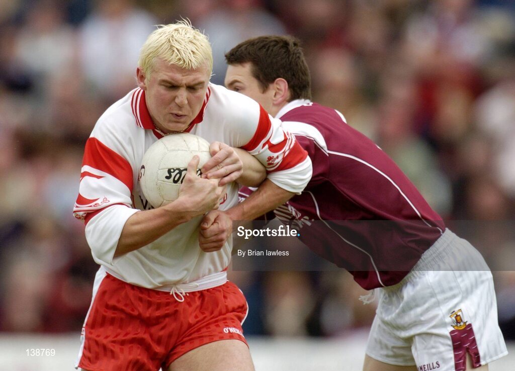 25 April 2004; Eoin Mulligan, Tyrone, in action against Declan Meehan, Galway. Allianz Football League 2004, Semi-Final Replay, Galway v Tyrone, Pearse Stadium, Galway. Picture credit; Brian Lawless / SPORTSFILE *EDI*