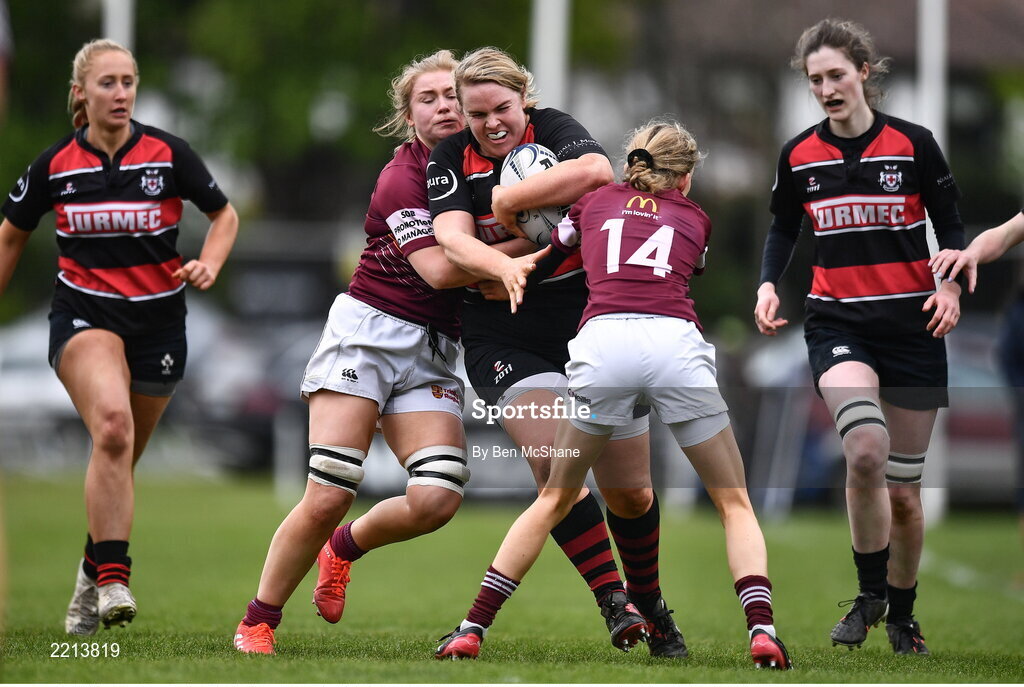 23 April 2022; Emer Feighery of Tullamore RFC is tackled by Tullow RFC players Tara Buggie, left, and Niamh Bailey during the Paul Flood Cup Final match between BTullamore RFC and Tullow RFC at Ollie Campbell Park, Old Belvedere RFC in Dublin. Photo by Ben McShane/Sportsfile
