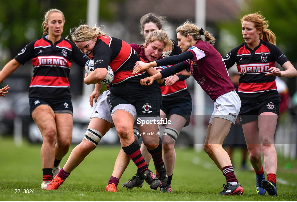 23 April 2022; Emer Feighery of Tullamore RFC is tackled by Tullow RFC players Tara Buggie, left, and Niamh Bailey during the Paul Flood Cup Final match between BTullamore RFC and Tullow RFC at Ollie Campbell Park, Old Belvedere RFC in Dublin. Photo by Ben McShane/Sportsfile
