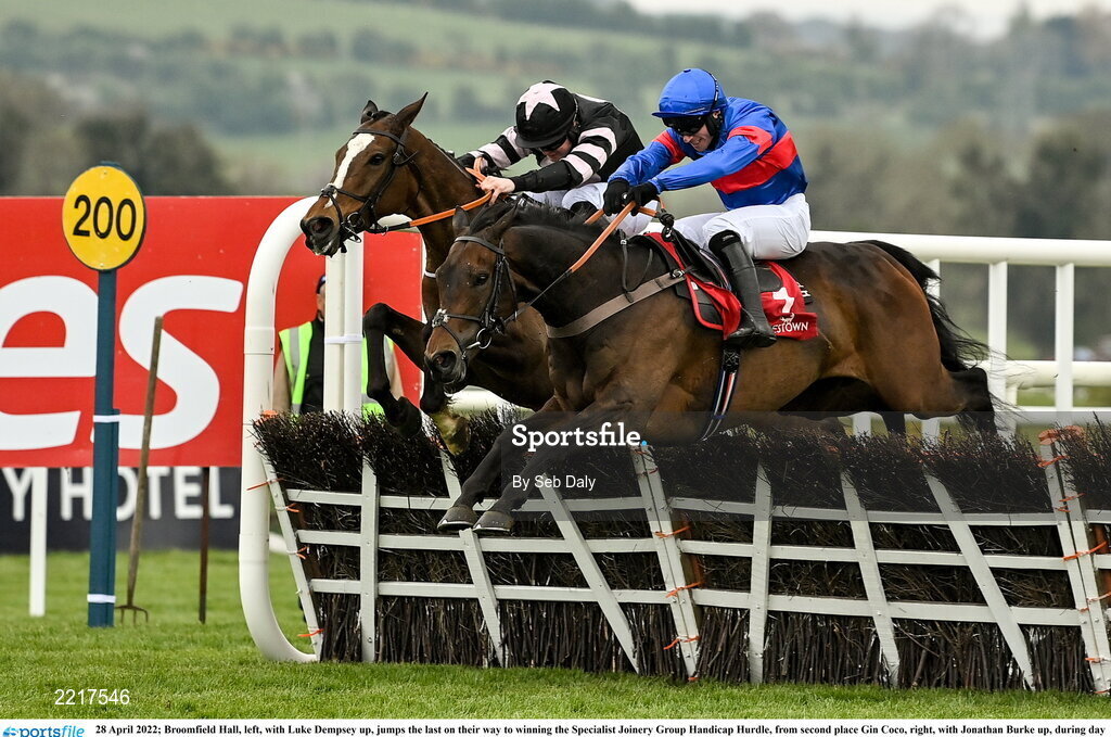 28 April 2022; Broomfield Hall, left, with Luke Dempsey up, jumps the last on their way to winning the Specialist Joinery Group Handicap Hurdle, from second place Gin Coco, right, with Jonathan Burke up, during day three of the Punchestown Festival at Punchestown Racecourse in Kildare. Photo by Seb Daly/Sportsfile