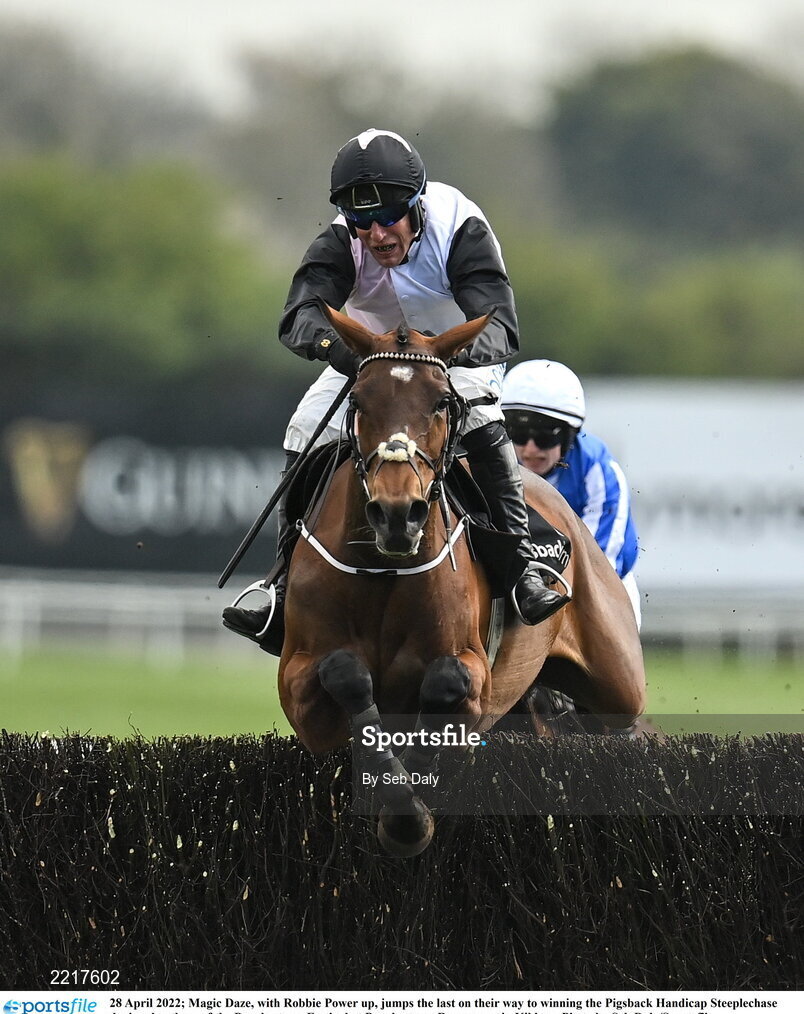 28 April 2022; Magic Daze, with Robbie Power up, jumps the last on their way to winning the Pigsback Handicap Steeplechase during day three of the Punchestown Festival at Punchestown Racecourse in Kildare. Photo by Seb Daly/Sportsfile