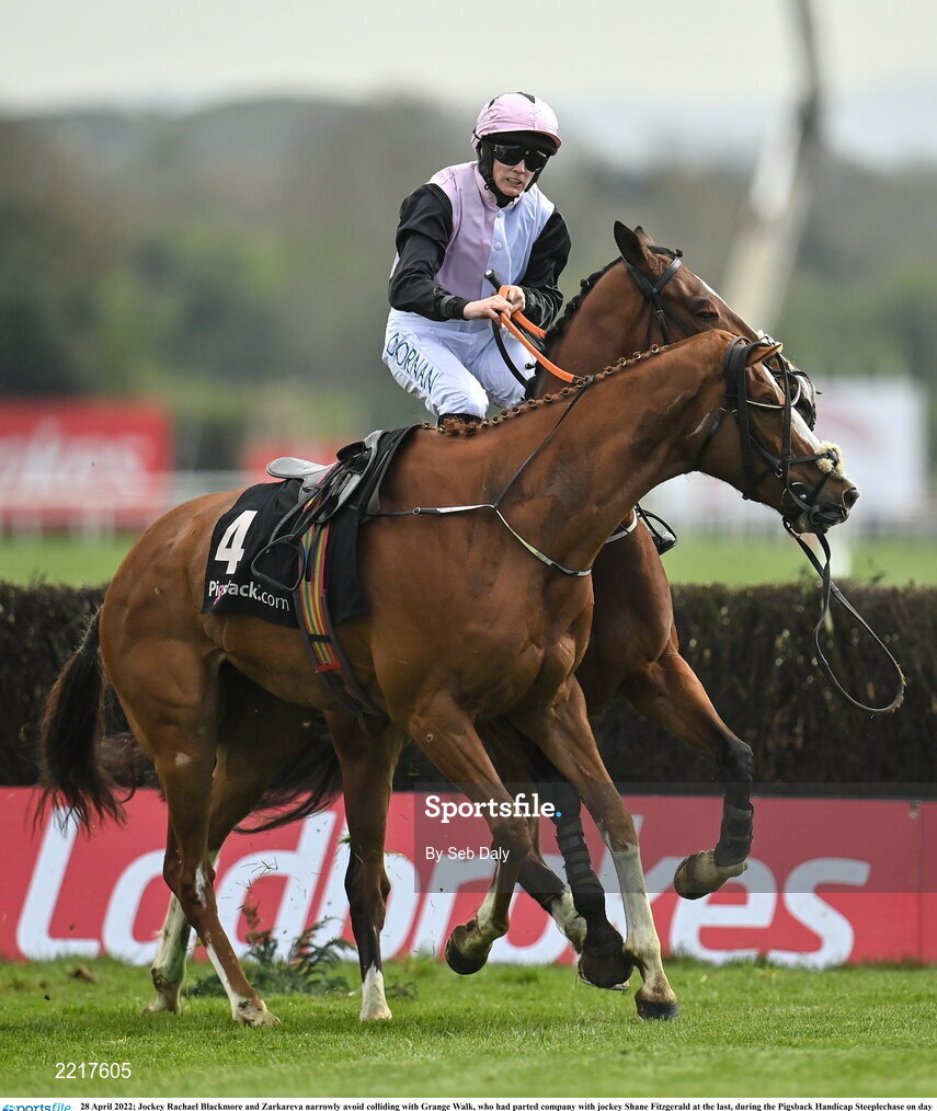 28 April 2022; Jockey Rachael Blackmore and Zarkareva narrowly avoid colliding with Grange Walk, who had parted company with jockey Shane Fitzgerald at the last, during the Pigsback Handicap Steeplechase on day three of the Punchestown Festival at Punchestown Racecourse in Kildare. Photo by Seb Daly/Sportsfile