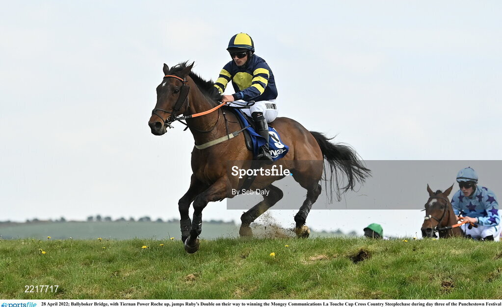 28 April 2022; Ballyboker Bridge, with Tiernan Power Roche up, jumps Ruby's Double on their way to winning the Mongey Communications La Touche Cup Cross Country Steeplechase during day three of the Punchestown Festival at Punchestown Racecourse in Kildare. Photo by Seb Daly/Sportsfile