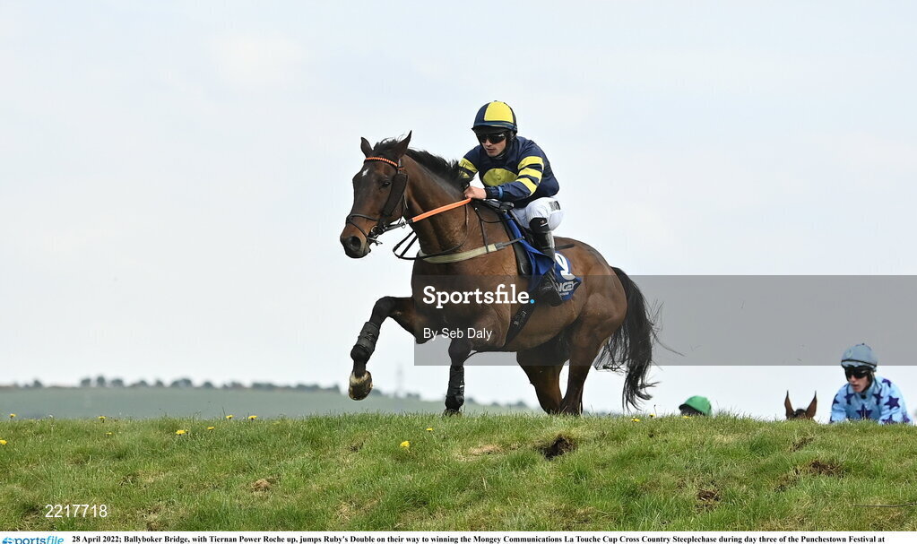 28 April 2022; Ballyboker Bridge, with Tiernan Power Roche up, jumps Ruby's Double on their way to winning the Mongey Communications La Touche Cup Cross Country Steeplechase during day three of the Punchestown Festival at Punchestown Racecourse in Kildare. Photo by Seb Daly/Sportsfile