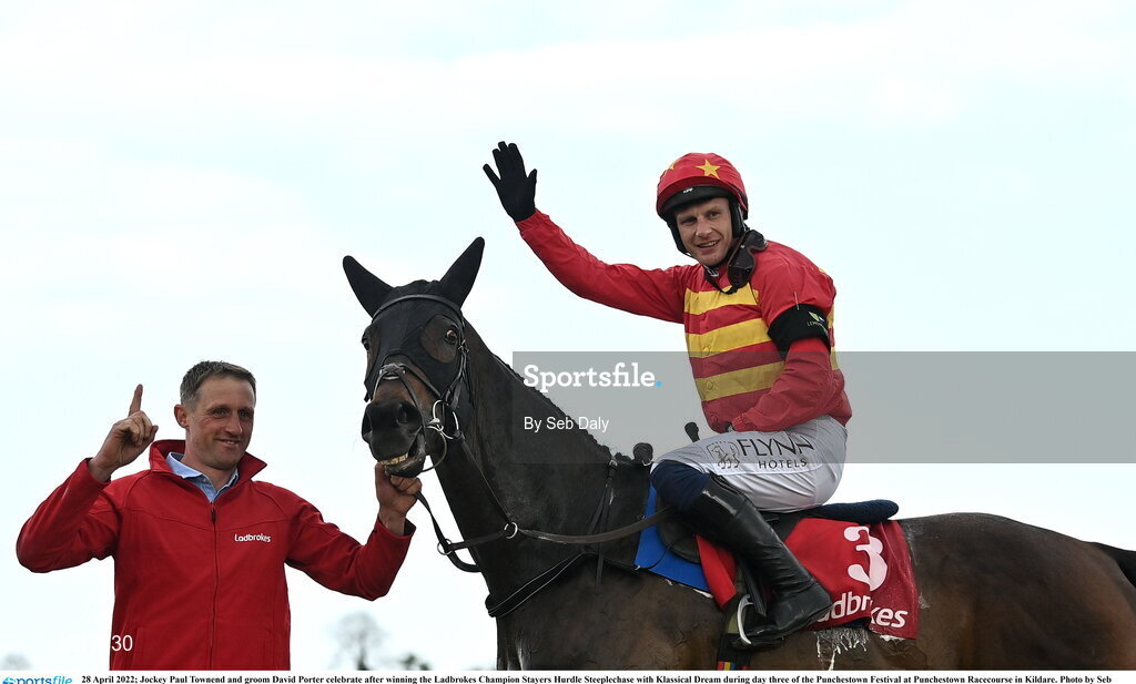 28 April 2022; Jockey Paul Townend and groom David Porter celebrate after winning the Ladbrokes Champion Stayers Hurdle Steeplechase with Klassical Dream during day three of the Punchestown Festival at Punchestown Racecourse in Kildare. Photo by Seb Daly/Sportsfile