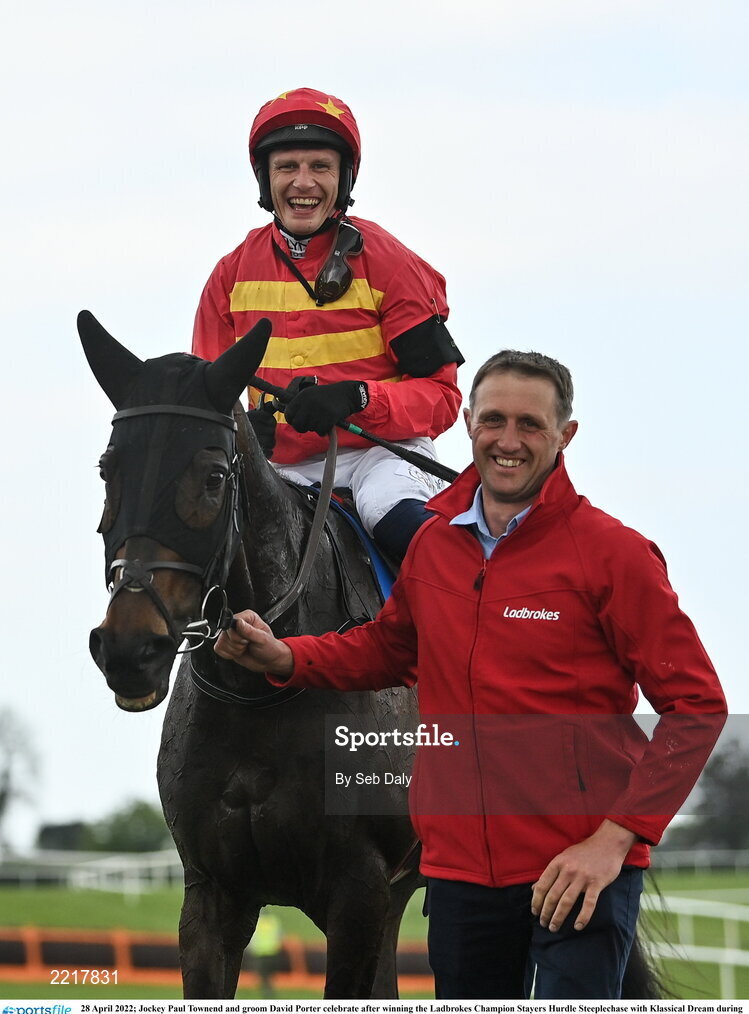 28 April 2022; Jockey Paul Townend and groom David Porter celebrate after winning the Ladbrokes Champion Stayers Hurdle Steeplechase with Klassical Dream during day three of the Punchestown Festival at Punchestown Racecourse in Kildare. Photo by Seb Daly/Sportsfile