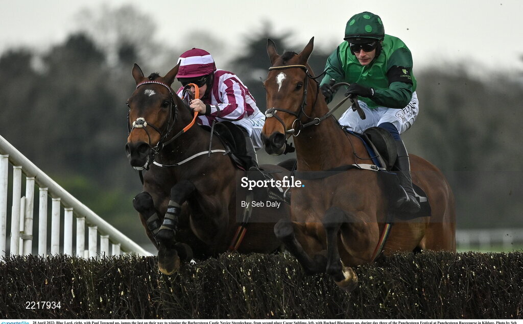 28 April 2022; Blue Lord, right, with Paul Townend up, jumps the last on their way to winning the Barberstown Castle Novice Steeplechase, from second place Coeur Sublime, left, with Rachael Blackmore up, during day three of the Punchestown Festival at Punchestown Racecourse in Kildare. Photo by Seb Daly/Sportsfile