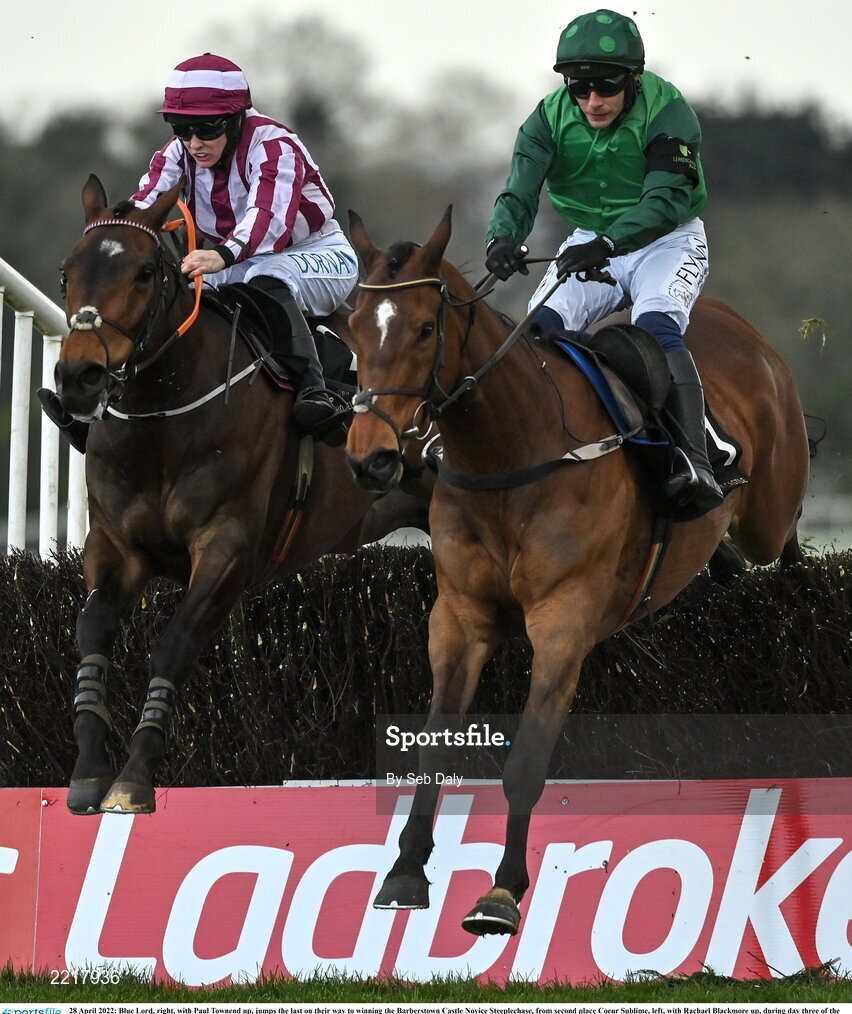 28 April 2022; Blue Lord, right, with Paul Townend up, jumps the last on their way to winning the Barberstown Castle Novice Steeplechase, from second place Coeur Sublime, left, with Rachael Blackmore up, during day three of the Punchestown Festival at Punchestown Racecourse in Kildare. Photo by Seb Daly/Sportsfile