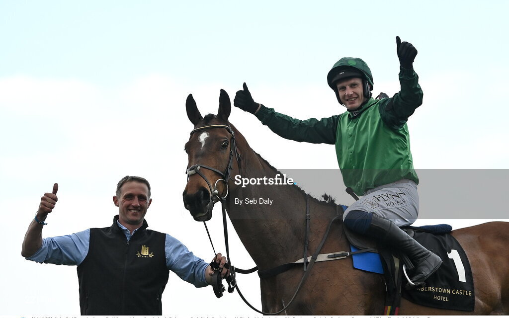 28 April 2022; Jockey Paul Townend and groom David Porter celebrate after winning the Barberstown Castle Novice Steeplechase with Blue Lord during day three of the Punchestown Festival at Punchestown Racecourse in Kildare. Photo by Seb Daly/Sportsfile