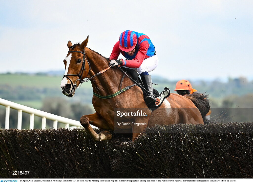 29 April 2022; Jezarus, with Ian Cribbin up, jumps the last on their way to winning the Stanley Asphalt Hunters Steeplechase during day four of the Punchestown Festival at Punchestown Racecourse in Kildare. Photo by David Fitzgerald/Sportsfile