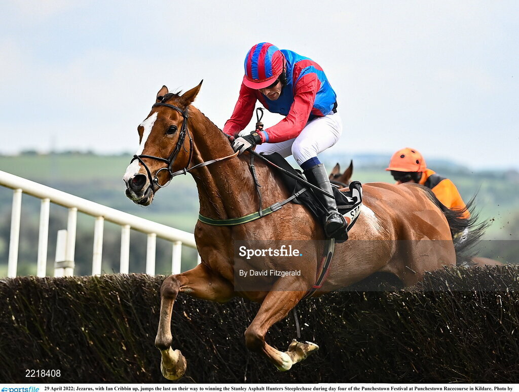 29 April 2022; Jezarus, with Ian Cribbin up, jumps the last on their way to winning the Stanley Asphalt Hunters Steeplechase during day four of the Punchestown Festival at Punchestown Racecourse in Kildare. Photo by David Fitzgerald/Sportsfile