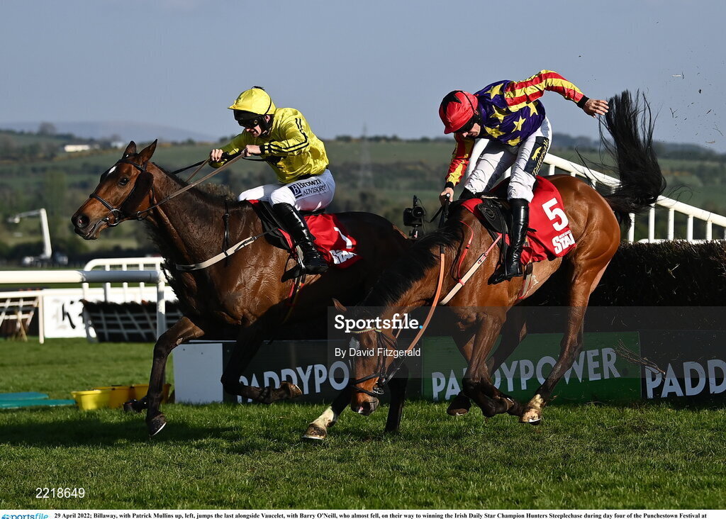 29 April 2022; Billaway, with Patrick Mullins up, left, jumps the last alongside Vaucelet, with Barry O'Neill, who almost fell, on their way to winning the Irish Daily Star Champion Hunters Steeplechase during day four of the Punchestown Festival at Punchestown Racecourse in Kildare. Photo by David Fitzgerald/Sportsfile