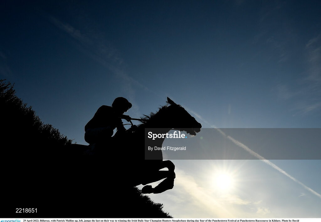 29 April 2022; Billaway, with Patrick Mullins up, left, jumps the last on their way to winning the Irish Daily Star Champion Hunters Steeplechase during day four of the Punchestown Festival at Punchestown Racecourse in Kildare. Photo by David Fitzgerald/Sportsfile