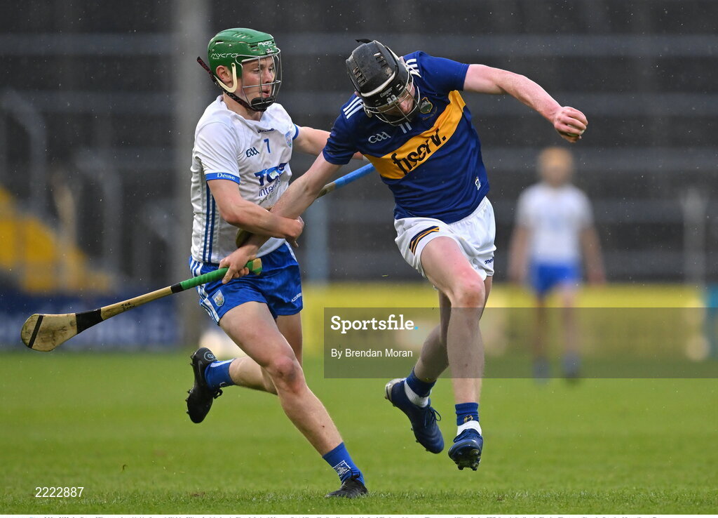 3 May 2022; Joe Egan of Tipperary is tackled by Darragh Walsh of Waterford during the Electric Ireland Munster GAA Minor Hurling Championship Semi-Final match between Tipperary and Waterford at FBD Semple Stadium in Thurles, Tipperary. Photo by Brendan Moran/Sportsfile