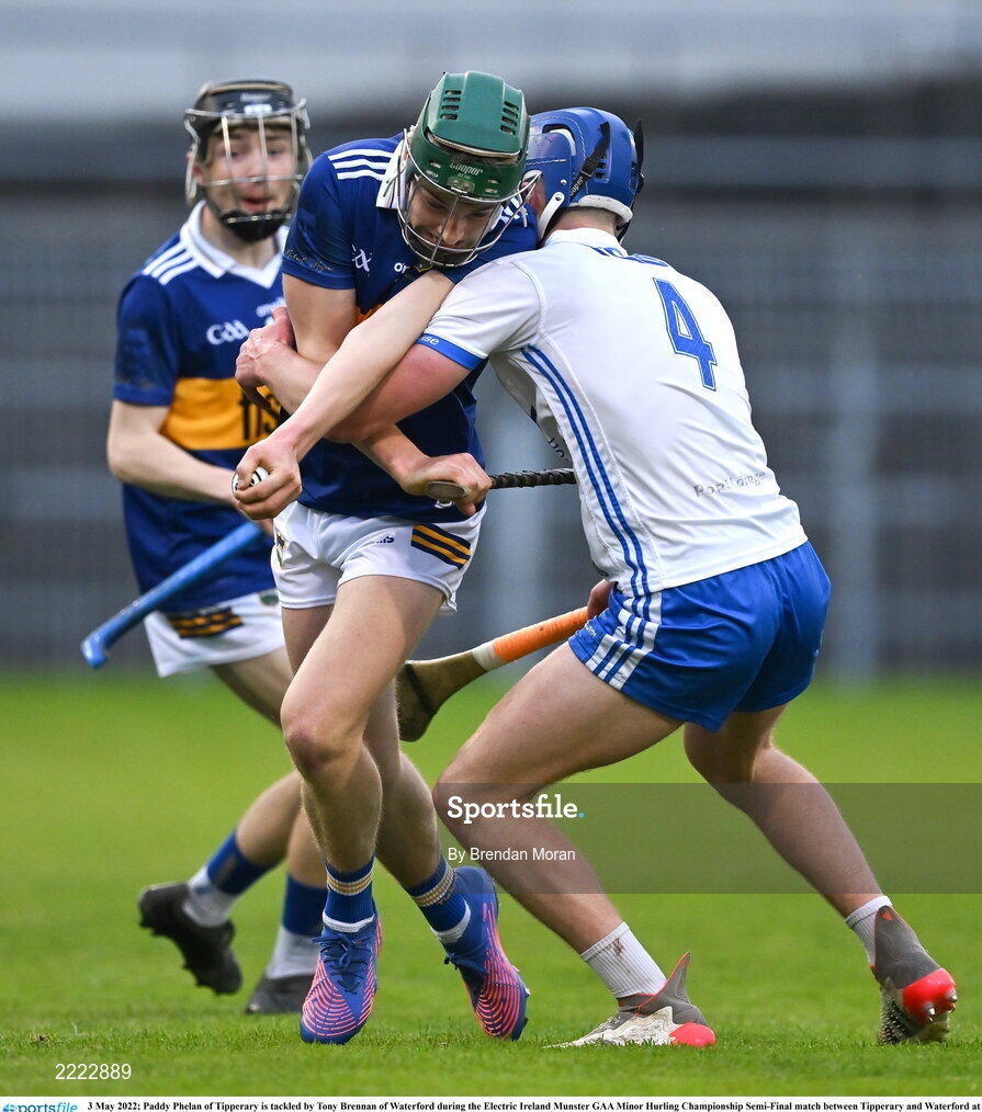 3 May 2022; Paddy Phelan of Tipperary is tackled by Tony Brennan of Waterford during the Electric Ireland Munster GAA Minor Hurling Championship Semi-Final match between Tipperary and Waterford at FBD Semple Stadium in Thurles, Tipperary. Photo by Brendan Moran/Sportsfile