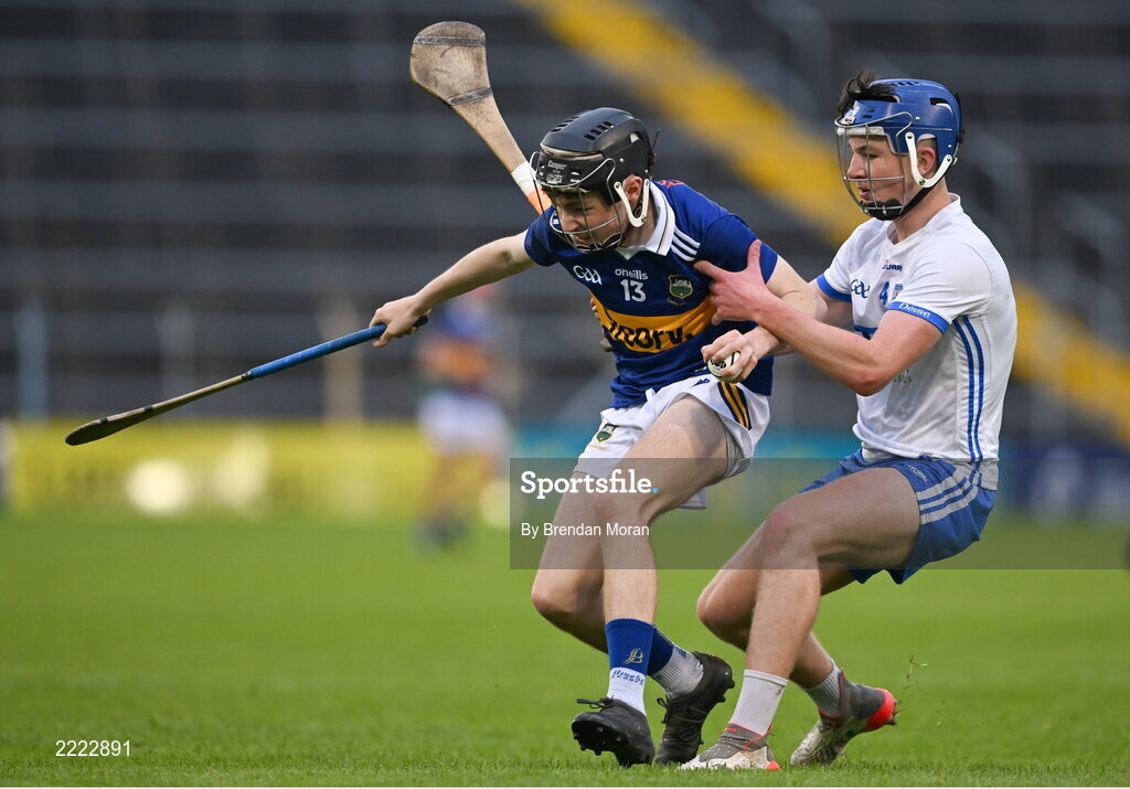 3 May 2022; Damien Corbett of Tipperary is tackled by Tony Brennan of Waterford during the Electric Ireland Munster GAA Minor Hurling Championship Semi-Final match between Tipperary and Waterford at FBD Semple Stadium in Thurles, Tipperary. Photo by Brendan Moran/Sportsfile