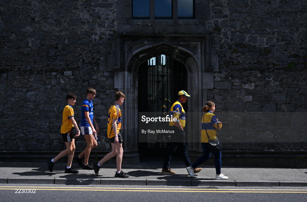 15 May 2022; Clare supporters walk past Ennis Friary on their way to the Munster GAA Hurling Senior Championship Round 4 match between Clare and Limerick at Cusack Park in Ennis, Clare. Photo by Ray McManus/Sportsfile