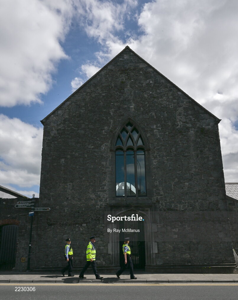 15 May 2022; Gardai walk past Ennis Friary on their way to the Munster GAA Hurling Senior Championship Round 4 match between Clare and Limerick at Cusack Park in Ennis, Clare. Photo by Ray McManus/Sportsfile