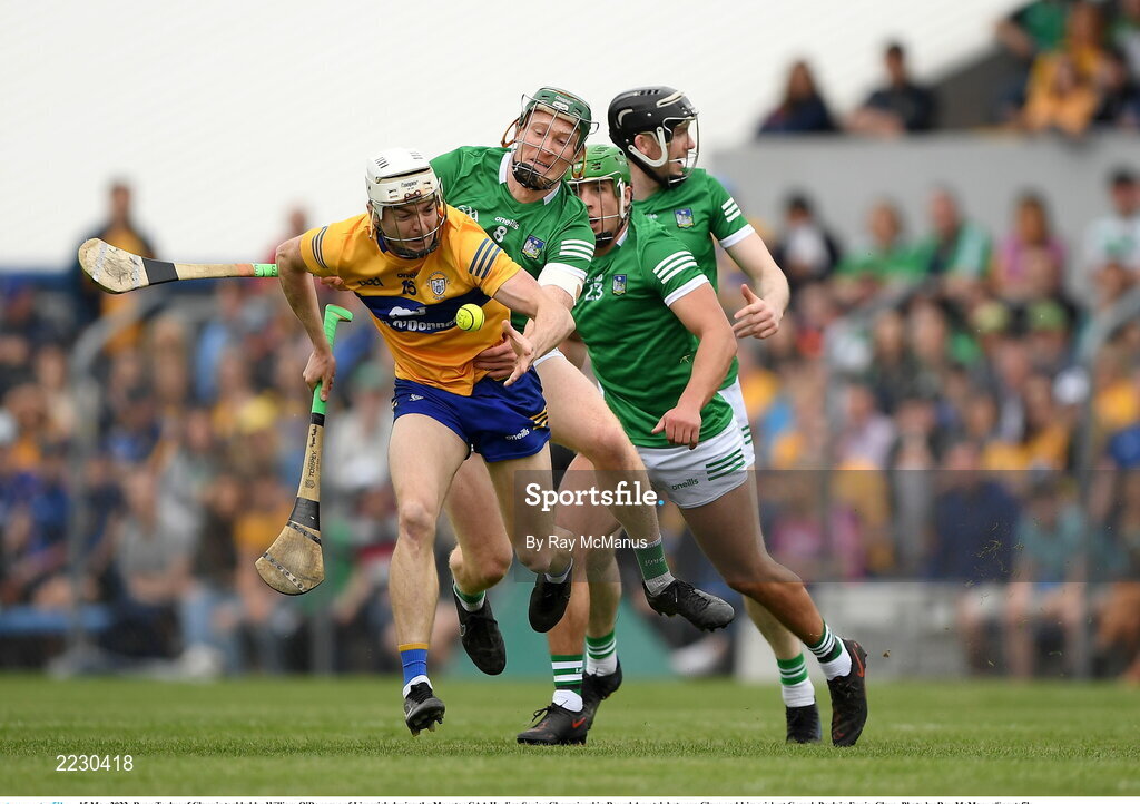 15 May 2022; Ryan Taylor of Clare is tackled by William O'Donogue of Limerick during the Munster GAA Hurling Senior Championship Round 4 match between Clare and Limerick at Cusack Park in Ennis, Clare. Photo by Ray McManus/Sportsfile